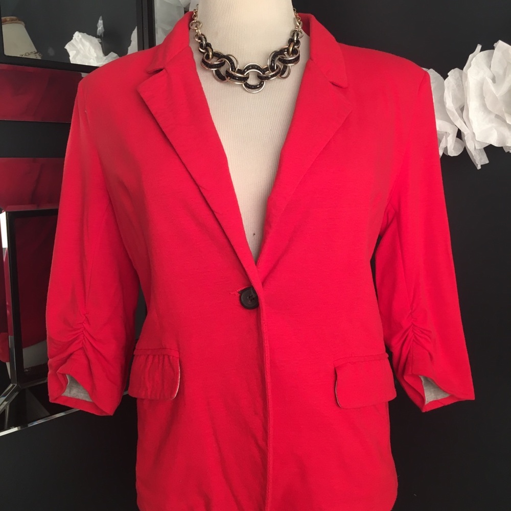 Bright orange/red, cotton blazer.